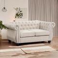 Canapé deux places Chesterfield capitonné